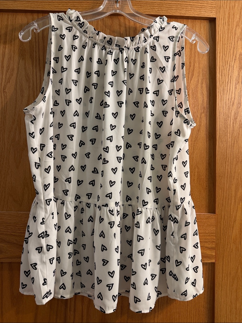 White Heart-Print Sleeveless Peplum Blouse